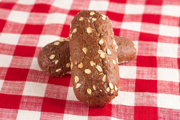 Brown Bread with Oats on a Red and White Checkered Table Cloth