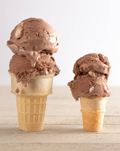 istock Chocolate Rocky Road Ice Cream Cone on a Wooden Table 1394523949