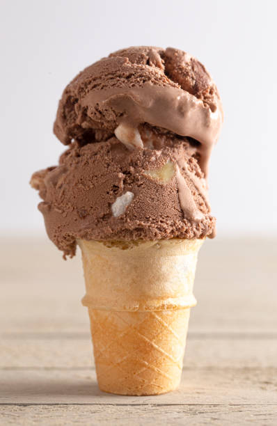 istock Chocolate Rocky Road Mini Ice Cream Cone on a Wooden Table 1394523955