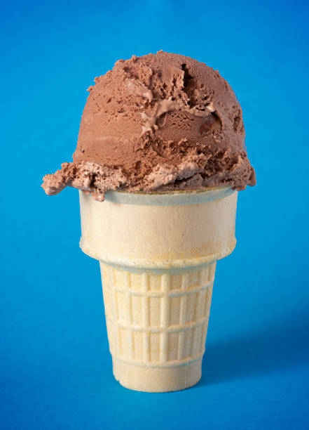 istock Chocolate Rocky Road Ice Cream Cone on a Blue Background 1394524529