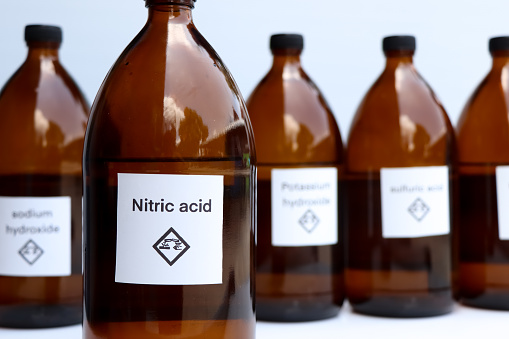 Nitric acid in bottle, chemical in the laboratory and industry