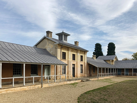 New Norfolk, Tasmania, Australia, April 17, 2022: Exterior view of historic buildings called The Barracks originally built as a hospital for invalid convicts around 1833.