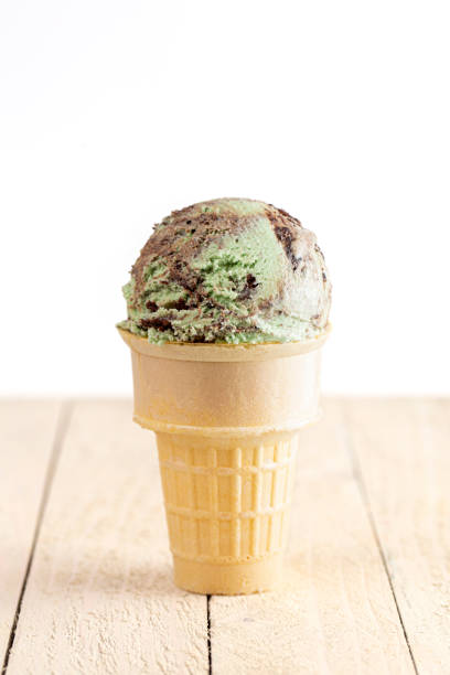 istock Mint Chocolate Chip Ice Cream on a Wooden Table 1394526192