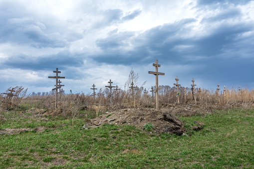 An old abandoned cemetery for homeless people. Dramatic landscape