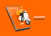 istock Male food delivery man in yellow uniform sits on scooter or motorcycle with a box 1394533352