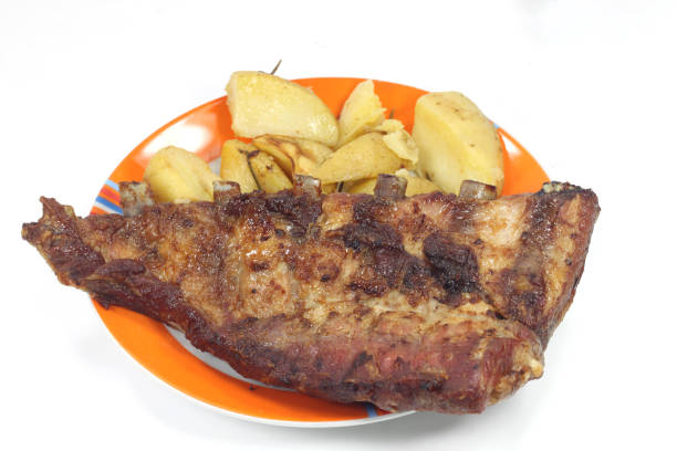 baked potatoes with grilled pork ribs