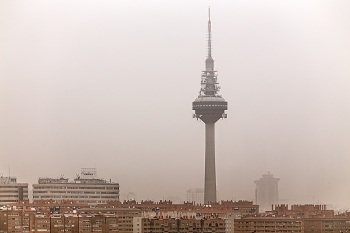 Madrid, Spain. March 15 2022. Spanish TV communications tower under Saharian dust haze
