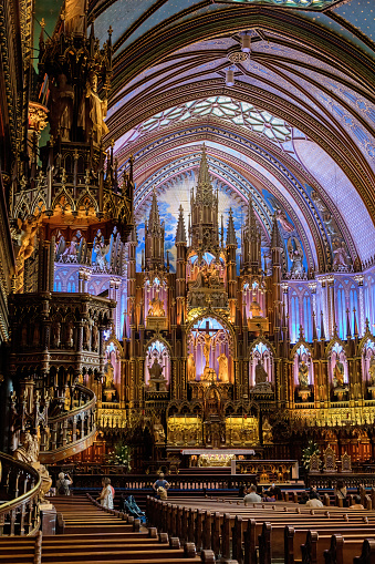 Montreal, Canada - 14 September 2017: Interior of the Notre-Dame Basilica in the historic district of Old Montreal, showing the gothic revival main alter.
