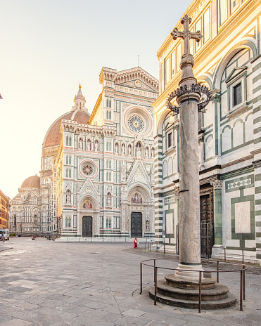 A picture of the famous Duomo of Florence at sunrise with the empty square