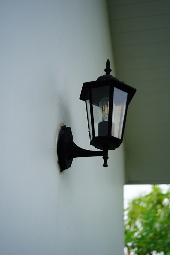Antique lamp on the stone wall