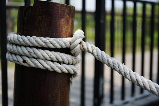 Close-up rope attached to the pier background