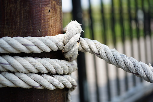 Close-up rope attached to the pier background