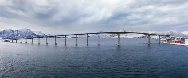 Photo of AndÃ¸y Bridge crossing the dredged RisÃ¸ysundet strait between the islands of AndÃ¸ya and HinnÃ¸ya, Nordland, Norway.