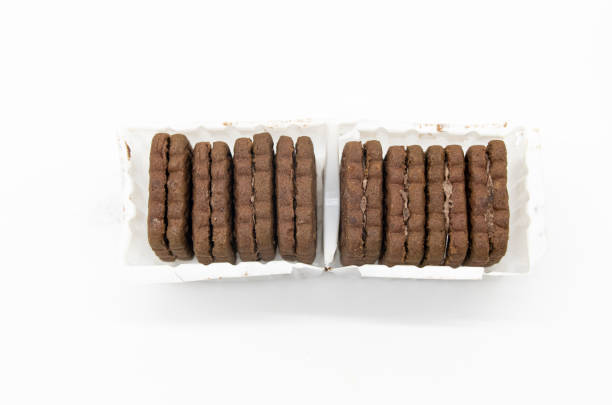 istock coffee color biscuit isolated on white background, horizontal view, selective focus 1394555269