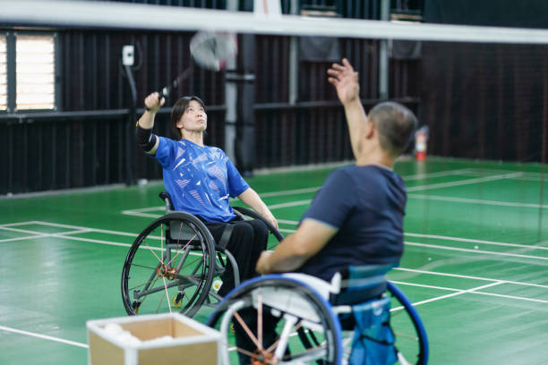 istock Handicapped badminton players actively training their skills 1394556002