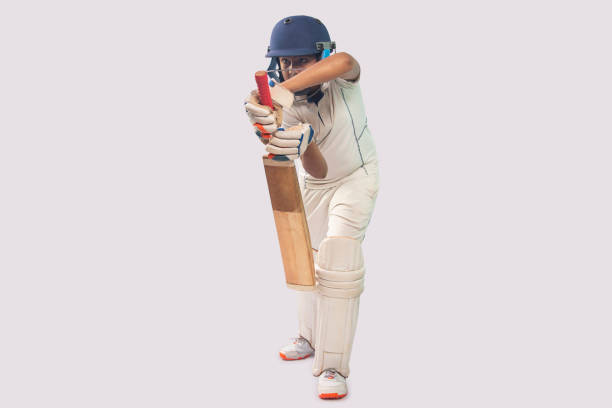 istock A boy in cricket uniform playing Cricket 1394556053
