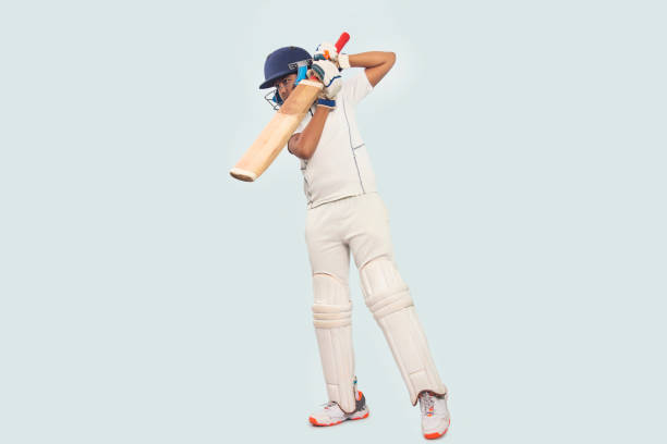 istock A boy in cricket uniform playing Cricket 1394556076