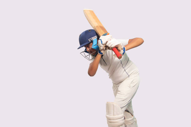 istock A boy in cricket uniform playing Cricket 1394556126