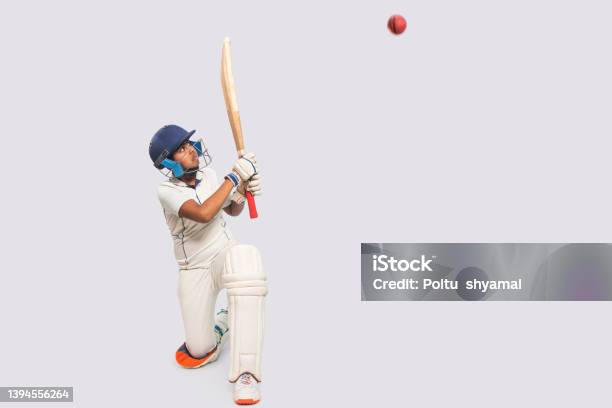 Portrait Of Boy Hitting A Shot During A Cricket Game Stock Photo - Download Image Now