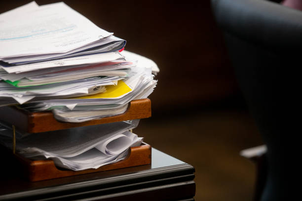istock Pile of unfinished documents on office desk, Stack of business paper 1394556962