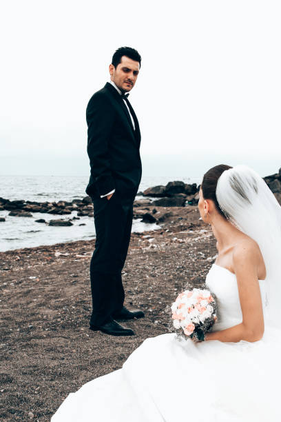 istock Newlyweds on the beach. 1394558127