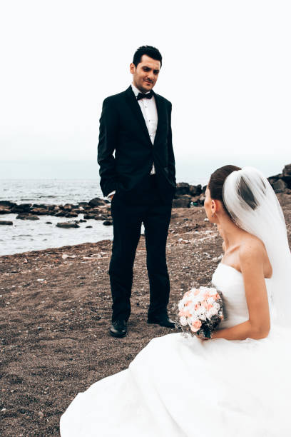 istock Newlyweds on the beach. 1394558129