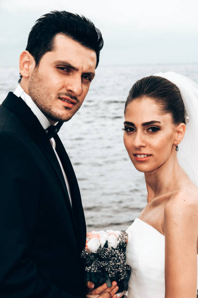 istock Newlyweds on the beach. 1394558409