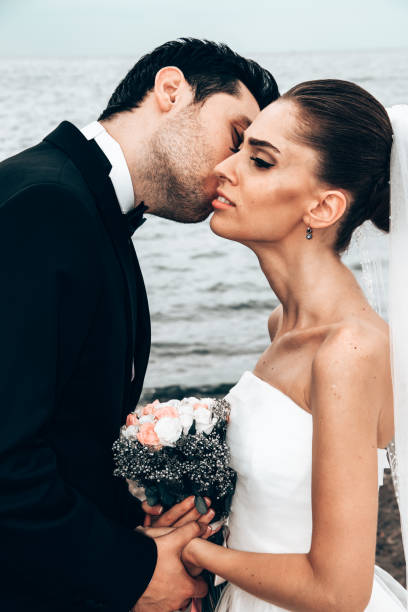 istock Newlyweds on the beach. 1394558465