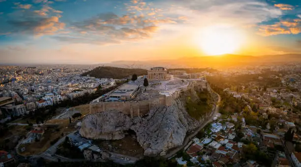 Panoramic sunrise view of the skyline of Athens with Acropolis, Parthenon Temple, old town Plaka and Lycabettus Hill