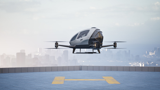 eVTOL-Electric Vertical Take Off standing on rooftop landing pad between the buildings. (3d render)