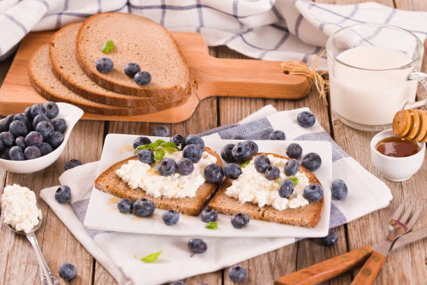 istock Rye bread with cottage cheese, blueberries and honey. 1394560890