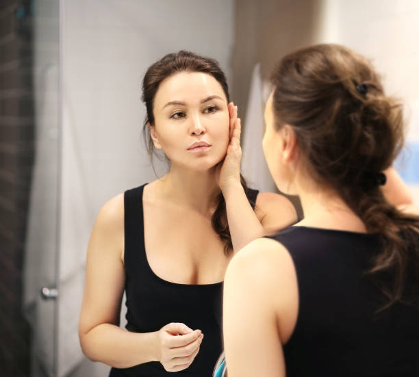 istock Magic anti-aging cream.Applying the cream. 1394566507