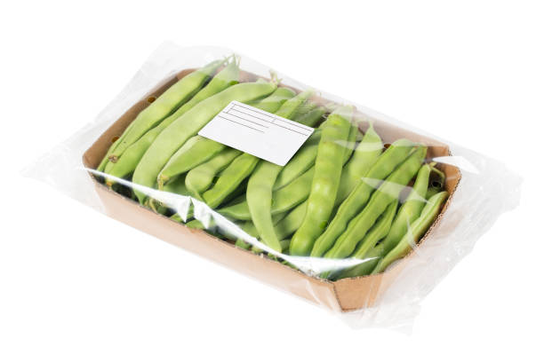 Packed and labeled green beans on isolated white background