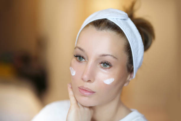 istock Applying the cream.Magic anti-aging cream. 1394566957