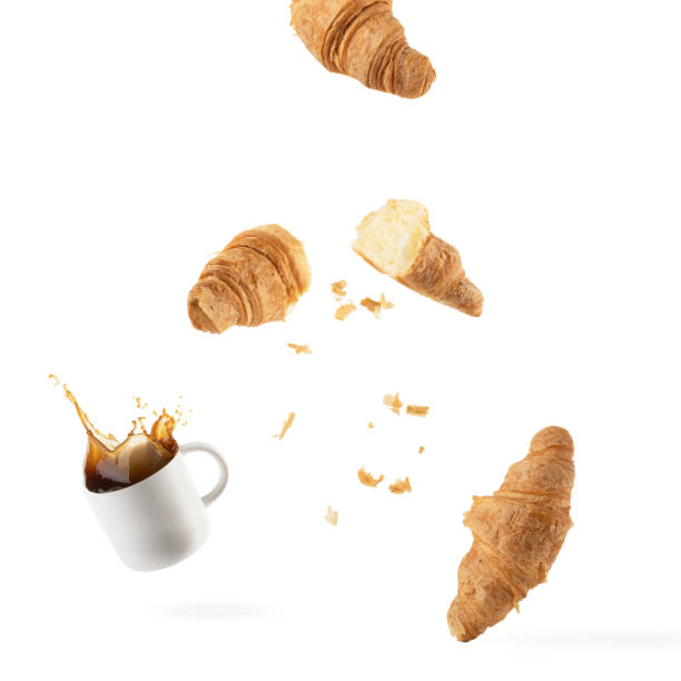 istock flying fresh croissants on a white background 1394567048
