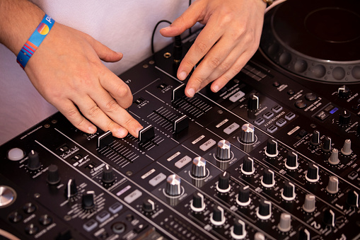Dj playing with a mixer