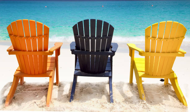 istock Three colorful beach chairs on Caribbean coast 1394593304