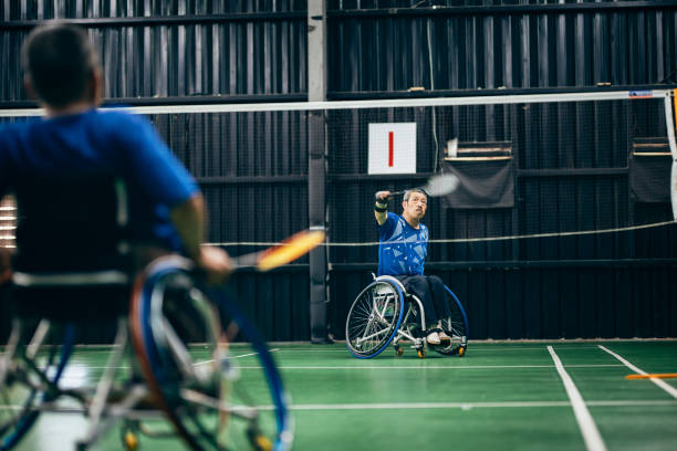 istock Enjoy life - Asian handicapped people training badminton 1394593439
