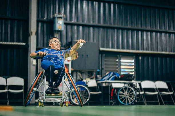 istock Enjoy life - Asian handicapped people training badminton 1394593441