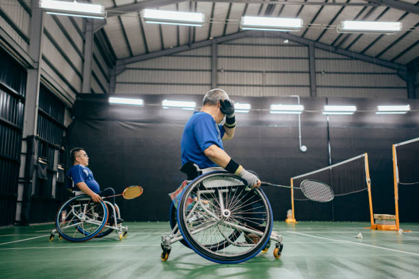 istock Enjoy life - Asian handicapped people training badminton 1394593604