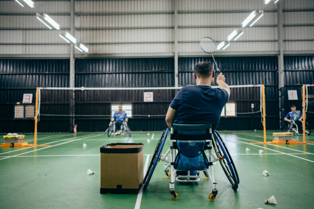 istock Enjoy life - Asian handicapped people training badminton 1394593606