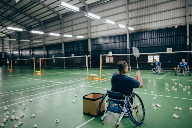 istock Enjoy life - Asian handicapped people training badminton 1394593638