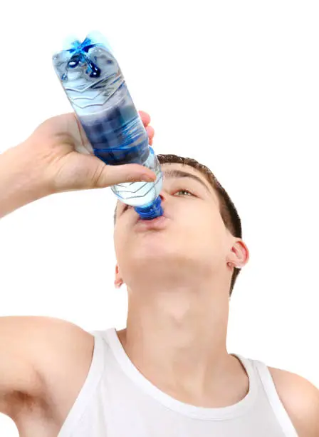 Teenager drinking the Pure Water on the White Background