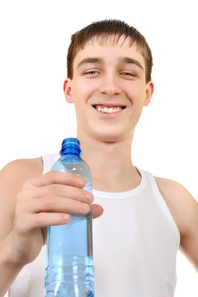 Happy Teenager with Bottle of Water on the White Background