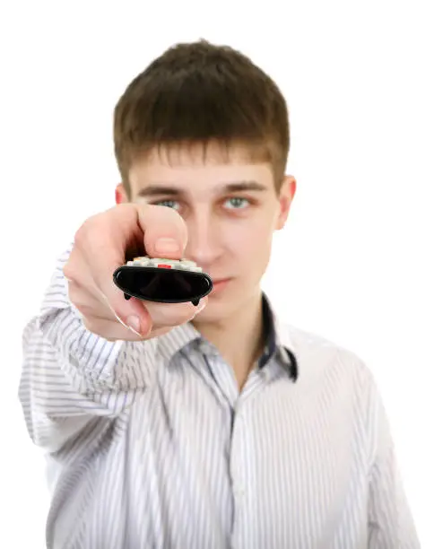 Teenager with Remote Control on the White Background