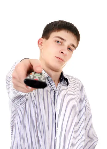 Displeased Teenager with Remote Control on the White Background
