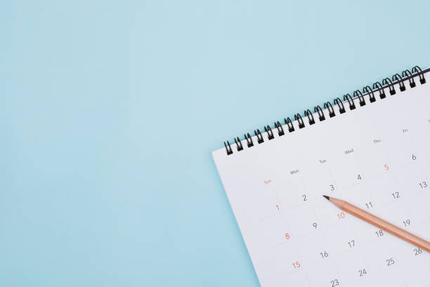istock calendar on the blue. empty copy space for text. concept for busy timeline organize schedule,appointment and meeting reminder. planning for business meeting or travel holiday planning concept. 1394594984