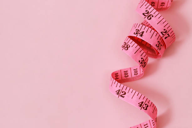 istock tape measure for obese people on a pink background soft focus 1394595887