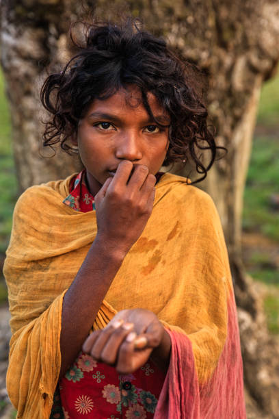 istock Poor Indian girl asking for help 1394596857