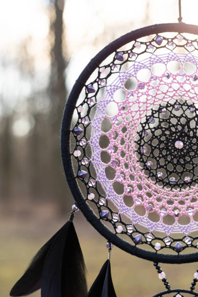 istock Handmade dream catcher with feathers threads and beads rope hanging 1394601088